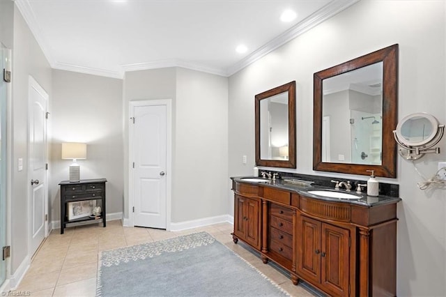 bathroom featuring tile patterned flooring, vanity, and ornamental molding