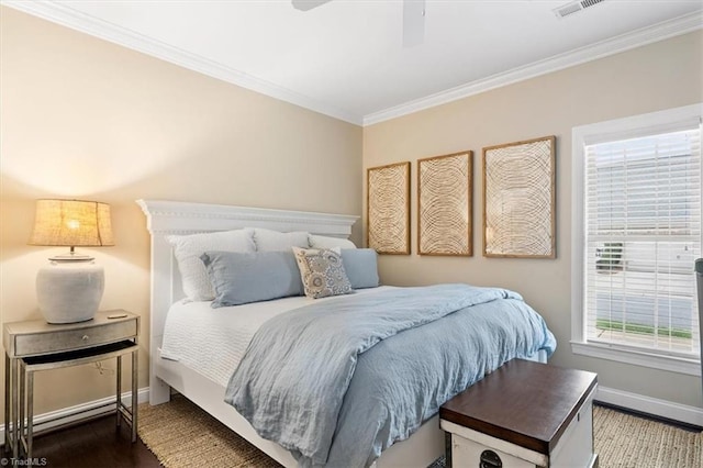 bedroom featuring hardwood / wood-style flooring, ceiling fan, and ornamental molding