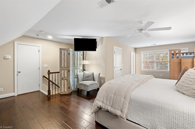 bedroom featuring dark hardwood / wood-style floors, ceiling fan, and lofted ceiling