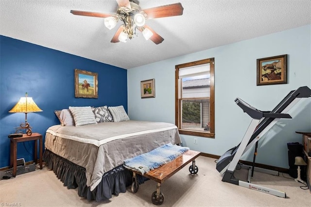 bedroom with light carpet, a textured ceiling, and ceiling fan