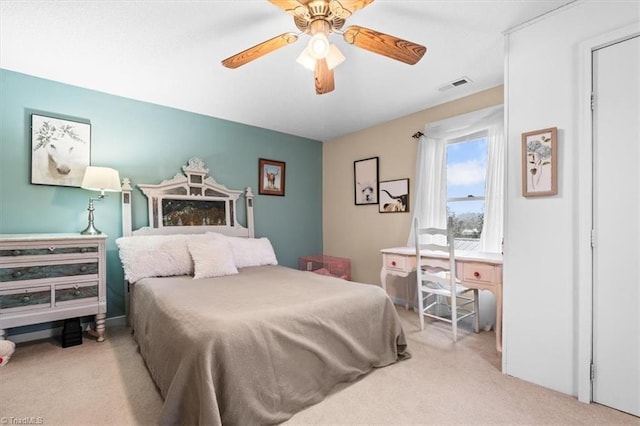 bedroom with light carpet and ceiling fan