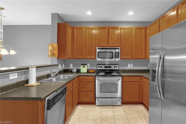 4455 Brassfield Dr Unit 306, Winston-Salem, NC 27105 - kitchen featuring appliances with stainless steel finishes, a sink, light tile patterned floors, dark countertops, and a chandelier