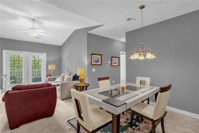 4455 Brassfield Dr Unit 306, Winston-Salem, NC 27105 - dining space featuring light carpet, ceiling fan, vaulted ceiling, a chandelier, and baseboards