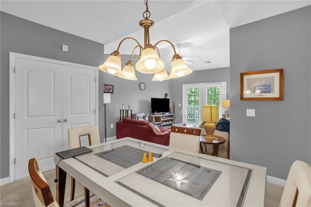 4455 Brassfield Dr Unit 306, Winston-Salem, NC 27105 - dining room featuring baseboards, lofted ceiling, and light colored carpet