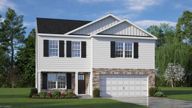 craftsman inspired home featuring a front yard and a garage