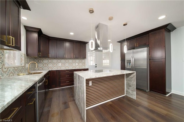 kitchen with dark wood-type flooring, exhaust hood, appliances with stainless steel finishes, and a sink