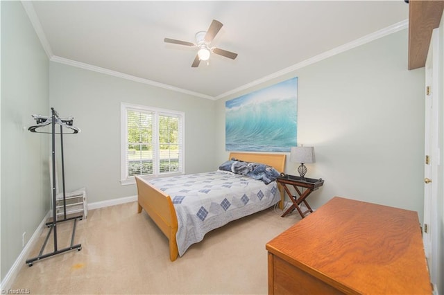 bedroom with light colored carpet, ceiling fan, baseboards, and ornamental molding