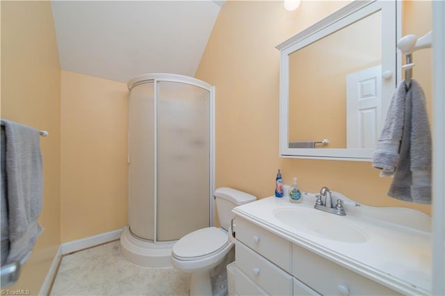 full bathroom featuring vaulted ceiling, vanity, a shower stall, and toilet