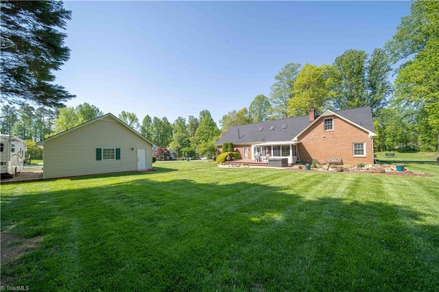 back of property with a yard
