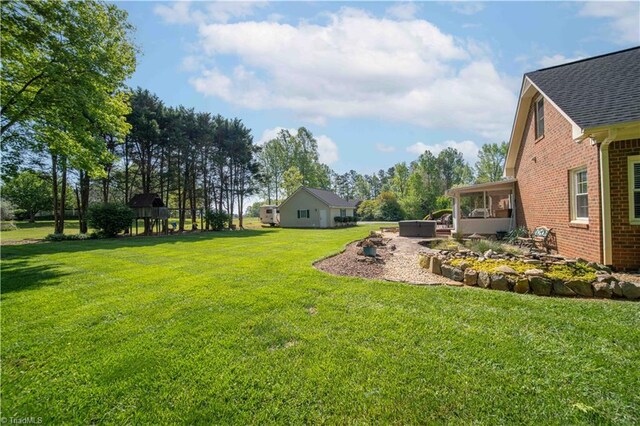 view of yard featuring a sunroom