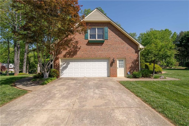 view of side of home featuring a lawn, an attached garage, brick siding, and driveway