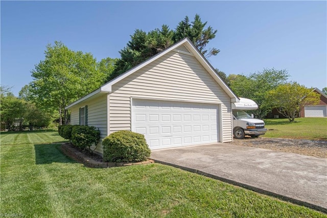 view of side of home featuring a lawn, an outdoor structure, and a detached garage
