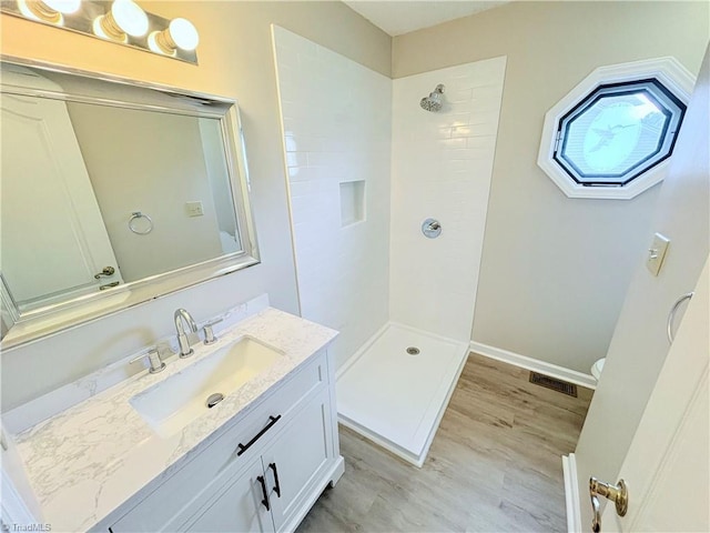 204 Maplewood Ct, Trinity, NC 27370 - full bathroom with a tile shower, vanity, and wood finished floors