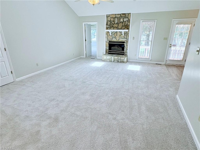 204 Maplewood Ct, Trinity, NC 27370 - unfurnished living room featuring ceiling fan, carpet floors, a stone fireplace, and lofted ceiling