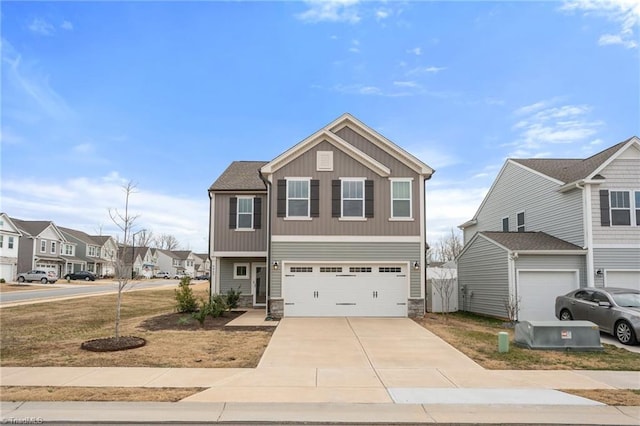 craftsman inspired home featuring concrete driveway, stone siding, an attached garage, and a residential view