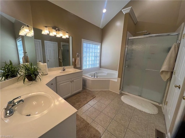 bathroom with plenty of natural light, vanity, independent shower and bath, and tile patterned flooring