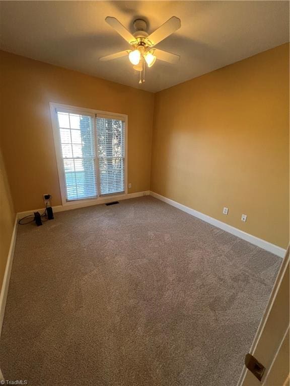 carpeted empty room with ceiling fan