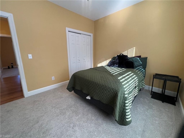 carpeted bedroom with a closet