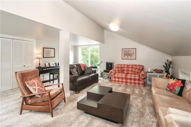 carpeted living room with lofted ceiling