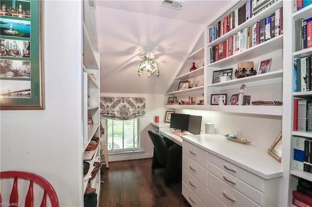 office featuring lofted ceiling, dark wood-style floors, visible vents, and built in study area