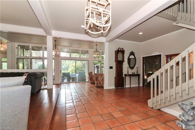 tiled entrance foyer with baseboards, beam ceiling, stairway, and a notable chandelier