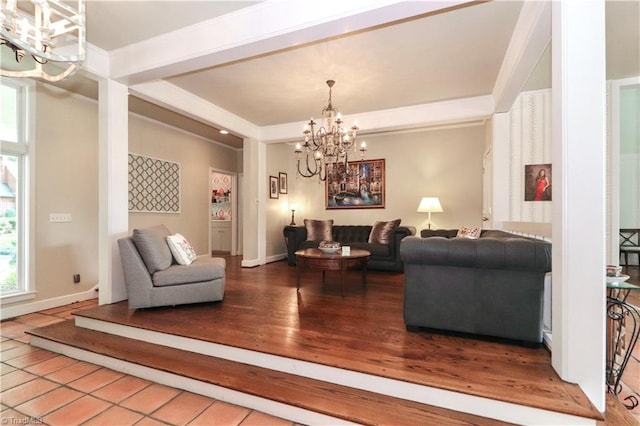 living room featuring an inviting chandelier and light wood-type flooring