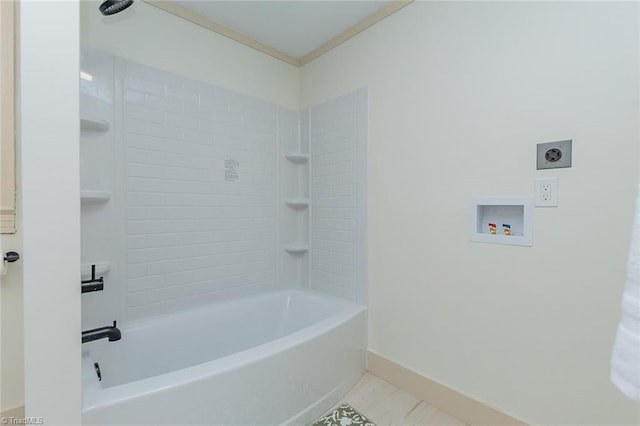 full bathroom featuring crown molding, shower / bath combination, and baseboards