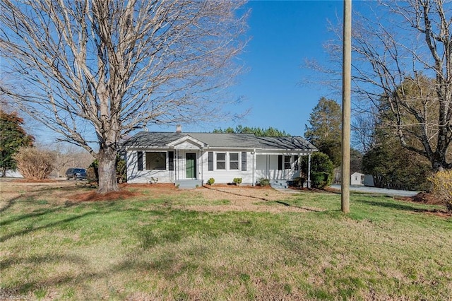 view of front of home featuring a front yard and a chimney