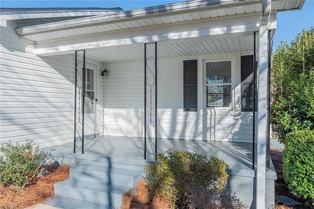 doorway to property featuring a porch