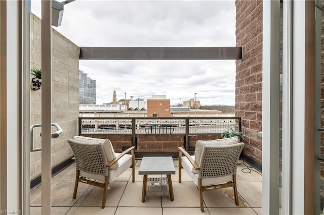 balcony featuring a view of city and outdoor lounge area