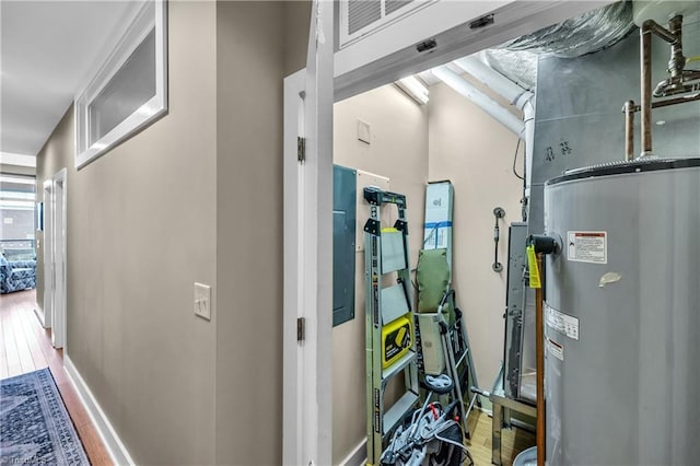 utility room with electric water heater