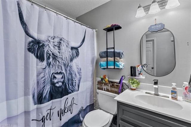 full bathroom with a shower with curtain, toilet, a textured ceiling, and vanity