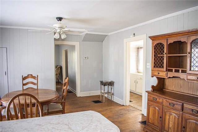 319 Cherry St, Eden, NC 27288 - dining room featuring baseboards, ornamental molding, a ceiling fan, and dark wood finished floors