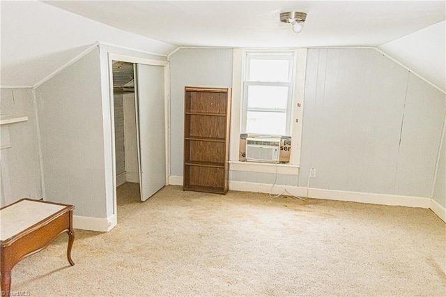 319 Cherry St, Eden, NC 27288 - bonus room with baseboards, lofted ceiling, cooling unit, and carpet