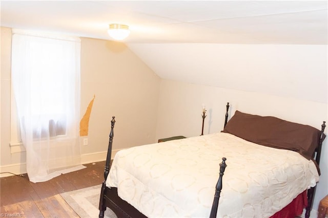 319 Cherry St, Eden, NC 27288 - bedroom with hardwood / wood-style floors, baseboards, and vaulted ceiling