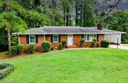 ranch-style house with a front yard