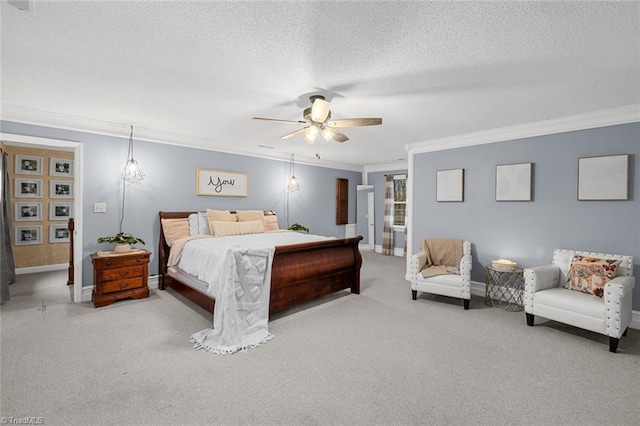 bedroom featuring a textured ceiling, ceiling fan, ornamental molding, and carpet floors