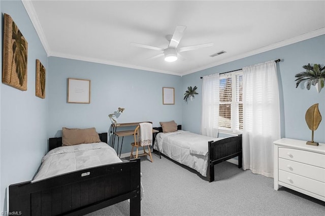 carpeted bedroom featuring ceiling fan and crown molding