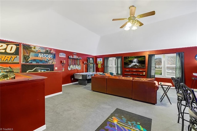 living room with carpet flooring, ceiling fan, and high vaulted ceiling