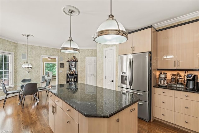 kitchen featuring light brown cabinets, crown molding, stainless steel fridge with ice dispenser, and hanging light fixtures