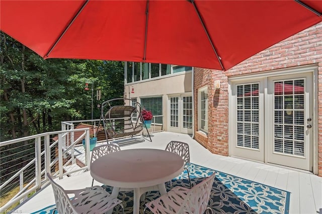 view of patio / terrace with a balcony and french doors