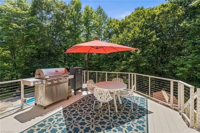 wooden terrace featuring grilling area