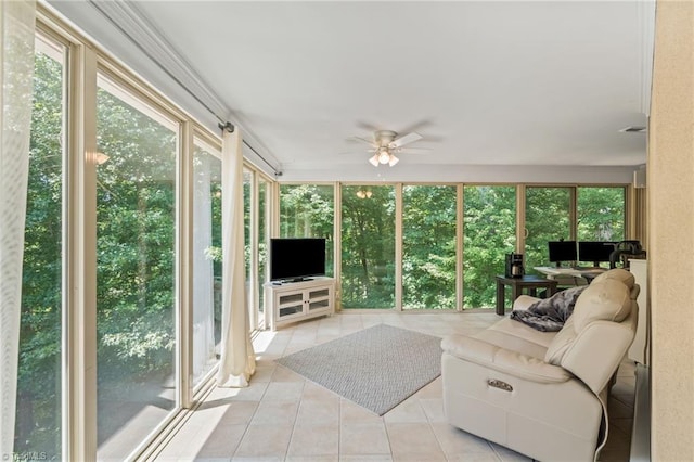 sunroom featuring ceiling fan