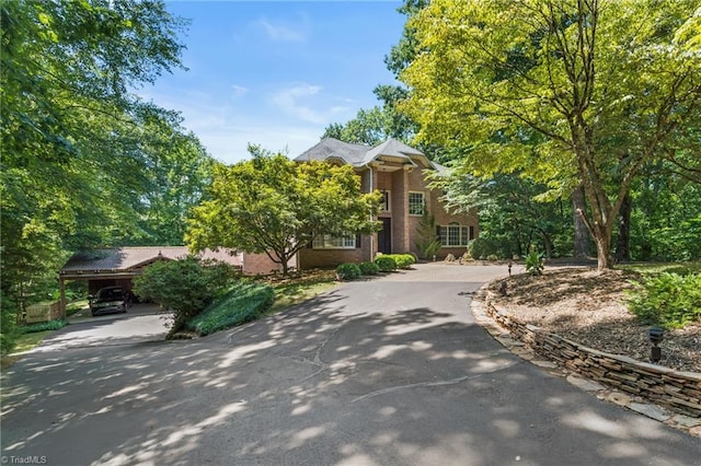 view of front of property featuring a carport