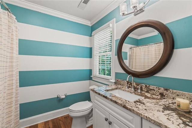 bathroom with hardwood / wood-style flooring, vanity, toilet, and crown molding