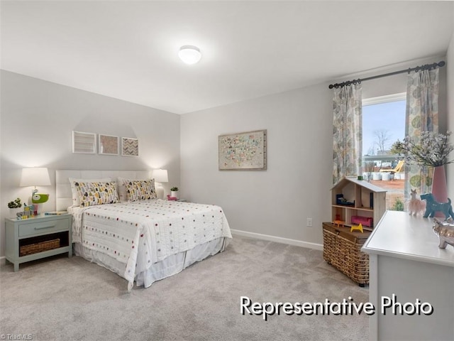 carpeted bedroom with baseboards