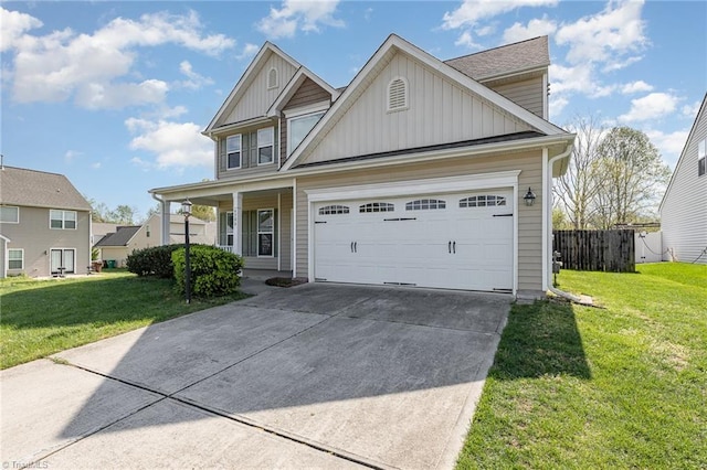 view of front of house with a front yard, a garage, board and batten siding, and driveway