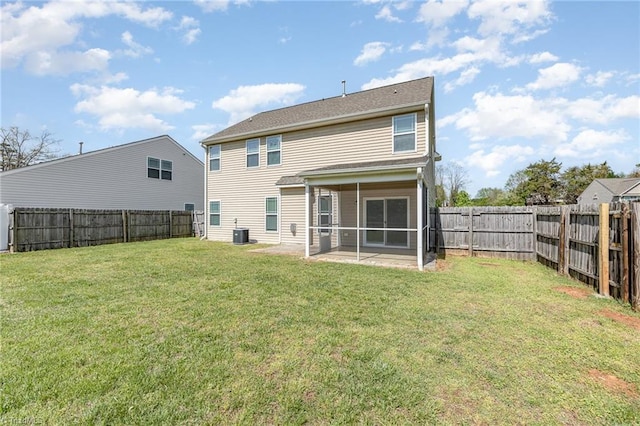 rear view of house featuring a yard, a fenced backyard, a sunroom, and central air condition unit