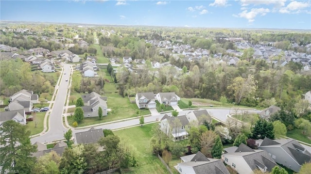 birds eye view of property with a residential view