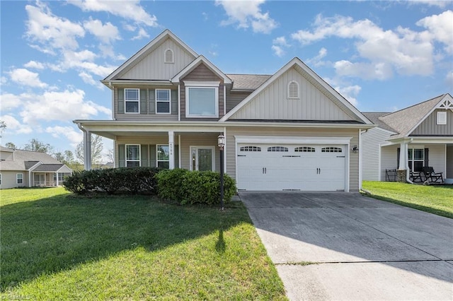 craftsman house with board and batten siding, concrete driveway, covered porch, and a front lawn